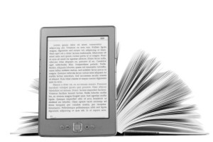 eBook placed in front of a hard copy book.